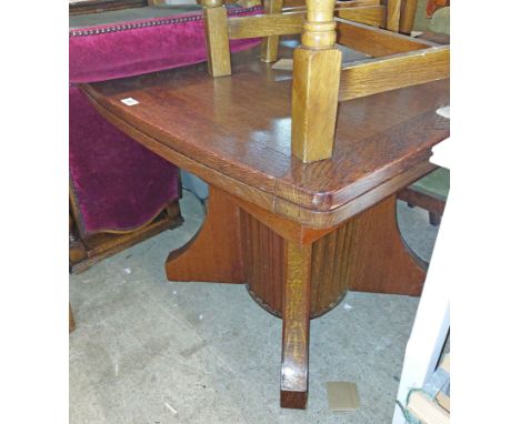 A 90cm vintage oak draw-leaf extending dining table, set on heavy fluted pillar and quatrefoil base - sold with a set of four