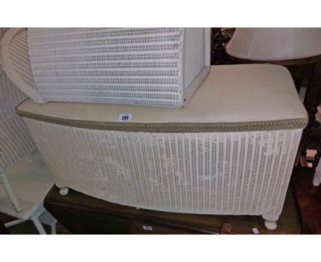 A vintage Lloyd Loom ottoman linen chest and a matching tub chair both with later painted finish - sold with two loom style l