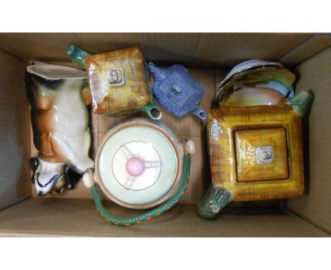 A box containing a quantity of ceramics including Clarice Cliff Crocus pattern biscuit barrel, dog form and other teapots, et