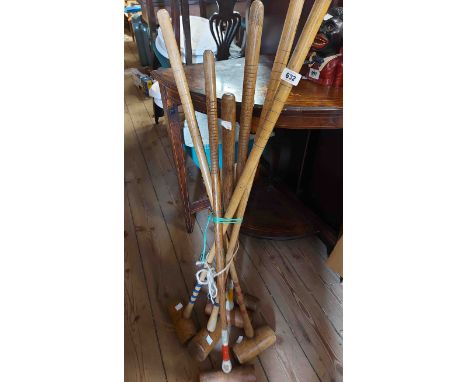 Six vintage croquet mallets