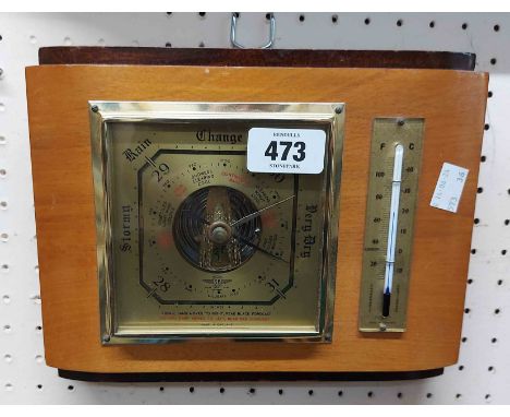 A vintage polished wood cased wall barometer/ thermometer by Shortland Bros with visible aneroid works