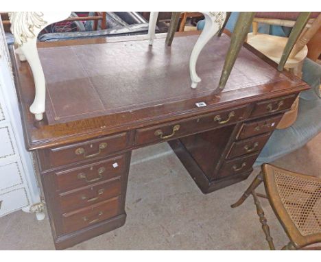 A 1.22m vintage polished mahogany twin pedestal desk with purple leather inset top, three frieze drawers and six flanking ped