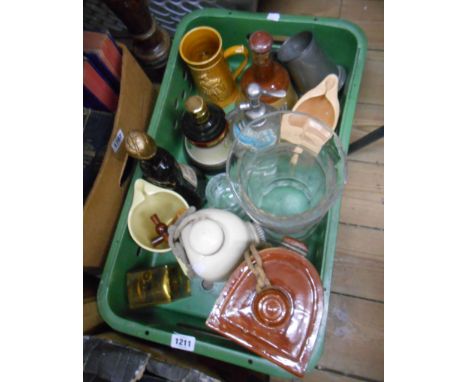 A crate containing a quantity of ceramic and collectable items including pub water jugs, vintage soda siphon, etc.