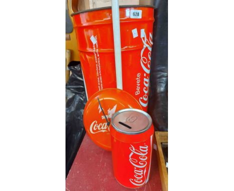 A vintage metal Coca-Cola wastepaper bin, clock and money box