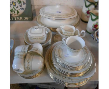 A quantity of Royal Doulton bone china, decorated in the Paisley pattern including tureen, butter dish, cups and saucers, pla
