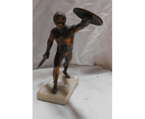 A brass statue, depicting a classical warrior with bronze effect finish, set on marble plinth