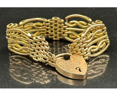 A 9ct gold gate bracelet with heart shaped fastener and a combined approximate weight of 20g.