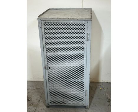 An Industrial metal cabinet, the hinged pierced door opens to a shelf inside, H108 X W50 X D50 cm