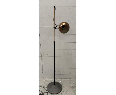 A Mid Century floor lamp with spherical copper effect shade 