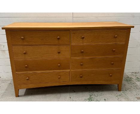 An eight drawer contemporary light oak chest of drawers. Height 92 150x51 cm