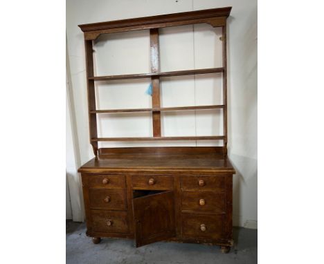 Light oak dresser with cornice top plate rack and drawers. cupboard base on bun feet. plate rack H141cm X W152cm. Base unit H
