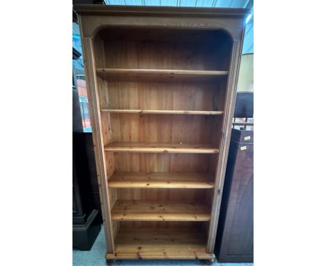 A five shelf pine bookcase (H182cm W93cm D27cm)
