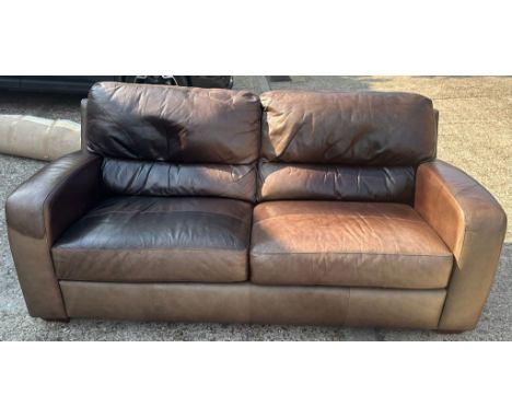 A two seater brown leather sofa (W200cm D91cm H95cm)
