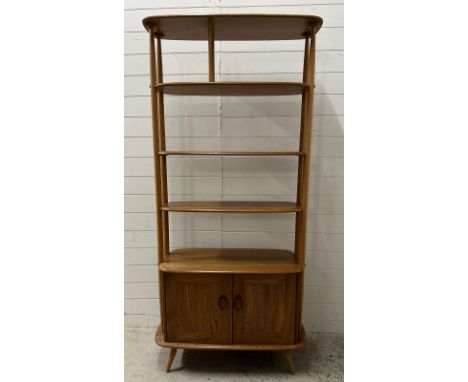 An Ercol mid century bookcase with two door cupboards under, H191 X 90 X 40 cm