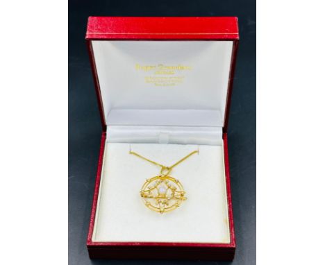 A 9ct gold opal and seed pearl brooch on an extra fine 9ct gold necklace.