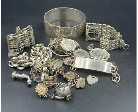 A selection of silver jewellery to include gate bracelets, identity bracelet etc. 