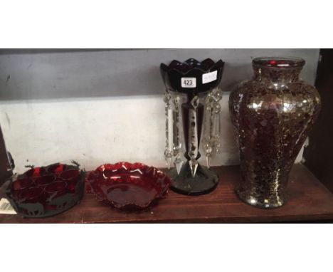 SHELF OF COLOURED GLASSWARE