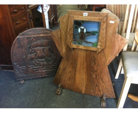 ART DECO OAK FIRE SCREEN WITH INSET LEADED GLASS PANEL OF AN OWL, NEEDS RE-WIRING &amp; ANOTHER CARVED OAK FIRE SCREEN OF A G