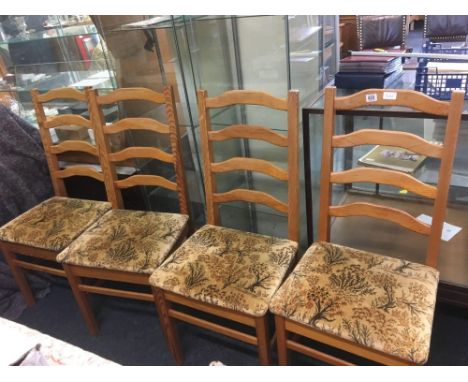 FOUR PINE LADDER BACK CHAIRS WITH UPHOLSTERED SEATS