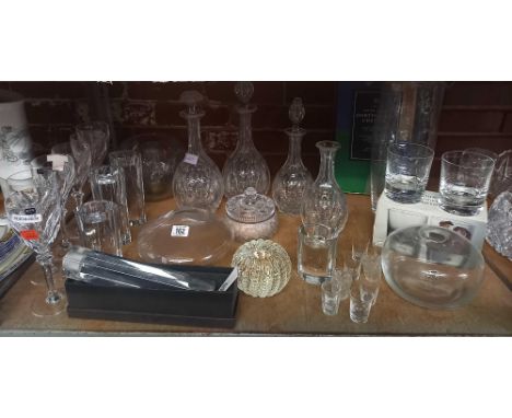 SHELF OF MISC GLASSES INCL: DECANTERS, ROSE BOWL, A LARGE DARTINGTON CRYSTAL VASE  A GLASS CANDLESTICK BY CASSINI