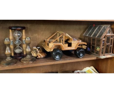 SHELF OF TREEN ITEMS, CANDLESTICKS, TIMER, JEEP, GREENHOUSE ETC