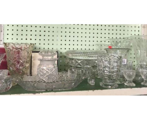 SHELF OF CUT GLASS VASES, BOWLS, EGG CUPS ETC