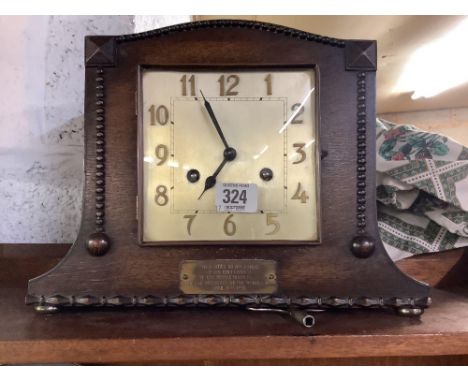 ART DECO CARVED OAK CHIMING MANTLE CLOCK WITH BRASS PLAQUE