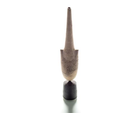 * Hans Coper (1920-1981), a stoneware cycladic vase: of arrow head form, the pitted matt ivory body with manganese rubbings s