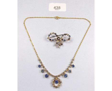 A vintage blue paste necklace and brooch