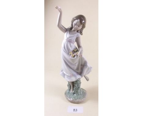 A Lladro figure of a girl throwing flowers - boxed 'Garden Dance'