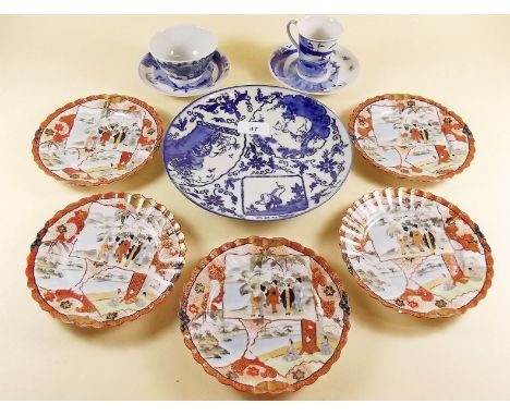 Two Japanese blue and white cups and saucers, five Kutani saucers and an Imari plate