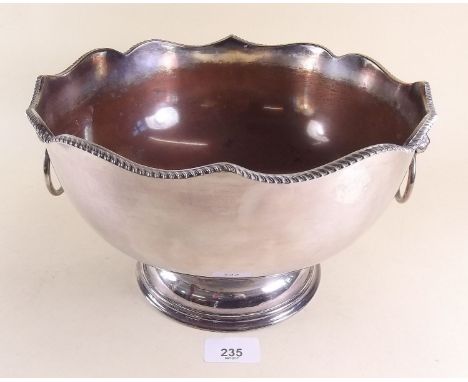 A silver plated on copper punch bowl with lion ring handles, 27cm dia.