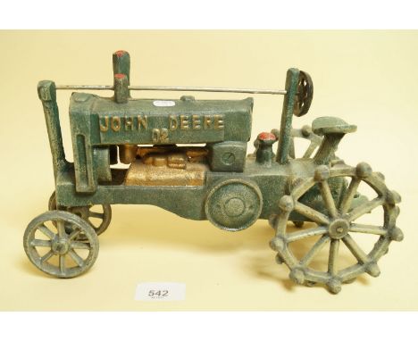 A painted cast metal John Deere tractor
