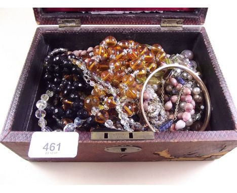 A box of vintage beads and costume jewellery