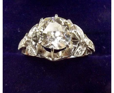 A fine platinum ring set large diamond (just over 2 carats) on diamond set shoulders, size N