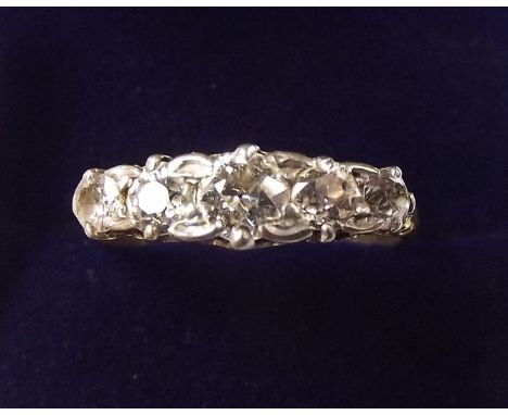 An 18 carat gold five stone diamond ring, size Q