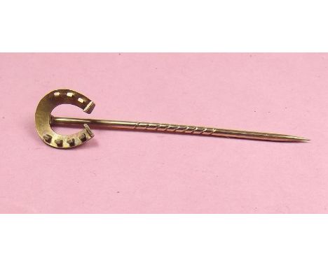 A 15 carat gold Edwardian horseshoe stick pin