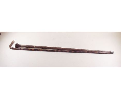 A rosewood handled walking cane and a bamboo walking stick with gold plated handle