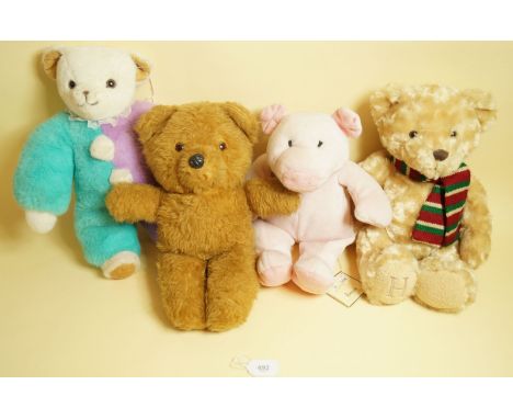 A Merrythought jester bear, a Harrods pig, a wind-up Blossom toy vintage teddy and another soft toy teddy