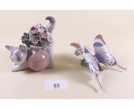 A Lladro butterfly 'A Moments Rest' and a cat 'Secret Spot' - both boxed
