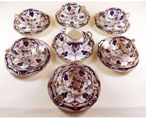 A Victorian Imari style tea service comprising six cups and saucers, six tea plates and jug