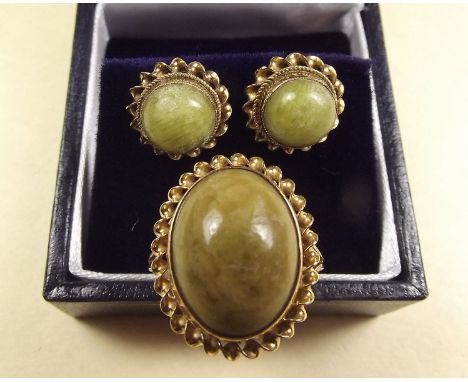 A 9 carat gold ring set green agate and a pair of matching earrings