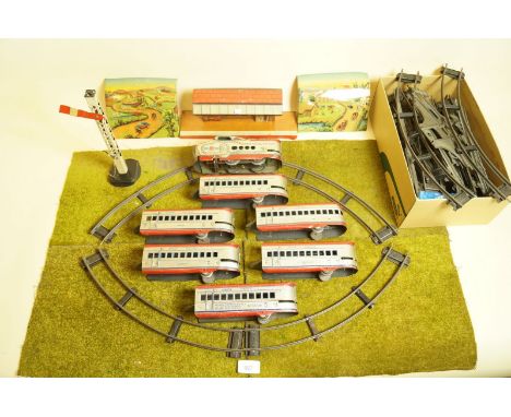 A Marx tin plate clockwork train set with Union Pacific loco, six carriages, station, tunnel, signal and figure of eight trac