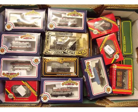 A quantity of OO gauge trucks - boxed, by Bachmann, Hornby, Maritime etc
