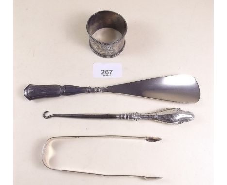 A pair of Georgian silver sugar tongs, a napkin ring, shoe horn and button hook