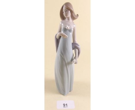 A Lladro figure of a standing girl - boxed 'Ingenue'
