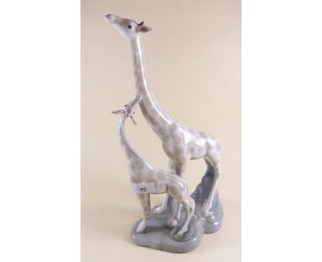 A Lladro style group of giraffes - with restored ear