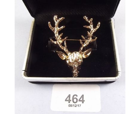 A vintage stags head brooch