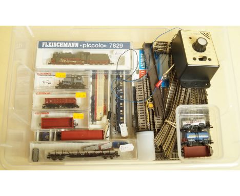 A Fleischman N gauge train set comprising engine 7829, engine and coaches set 7802 and various coaches and trucks, track and 