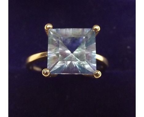 A 9K gold ring set aurora topaz, size M and a half